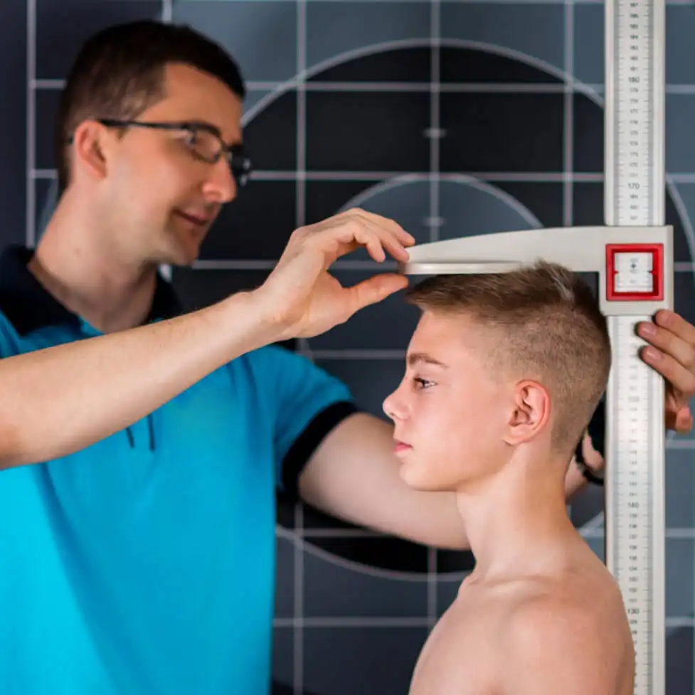 A teenage boy's height is being measured by a physical therapist. which needs to be converted in 150 cm to inches